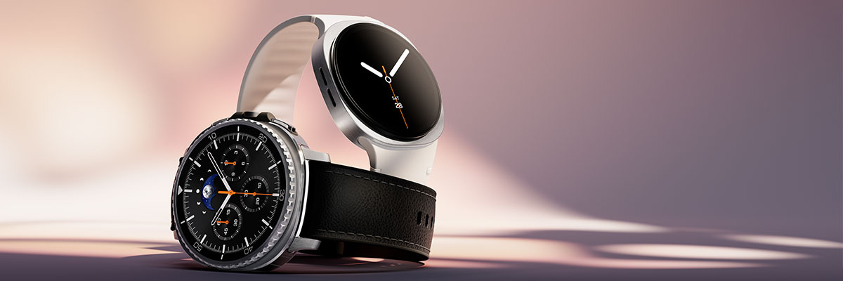A Galaxy Watch8 Classic lies flat in the foreground. Behind it, a Galaxy Watch8 stands upright.
